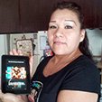 A lady holding a kindle fire